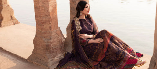 A women sitting by the water wearing elegant Abeer dress from Soraya collection by Farah. K