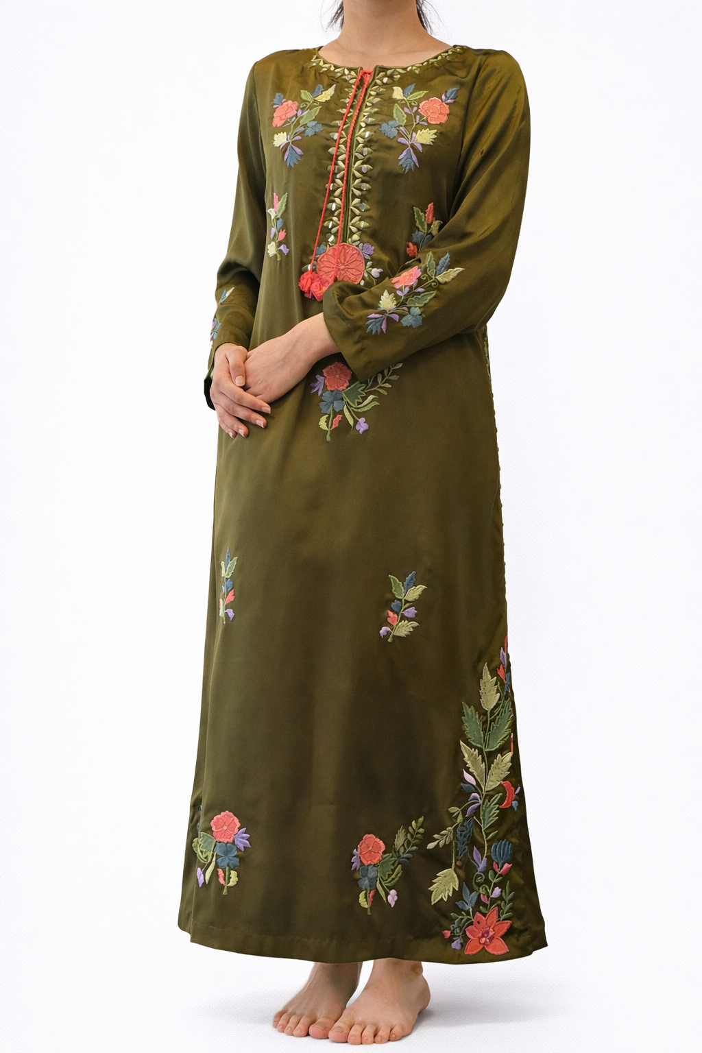 Green embroidered dress on a white background