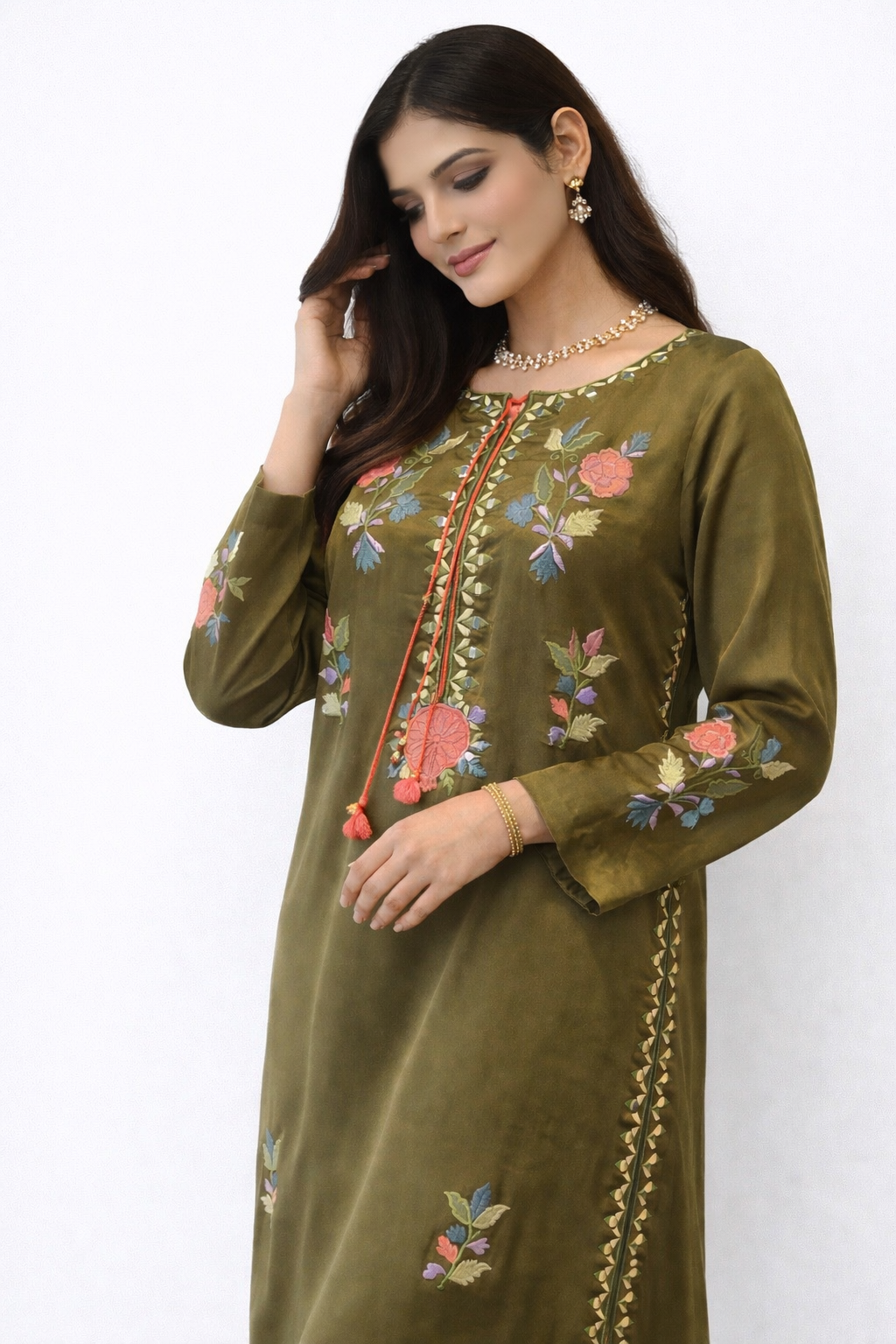 Olive raw silk long Close-up of Olive Enigma dress in raw silk with multi-color floral appliqué and embroidery, handcrafted in Pakistan for Eid 2026. urta kaftan 