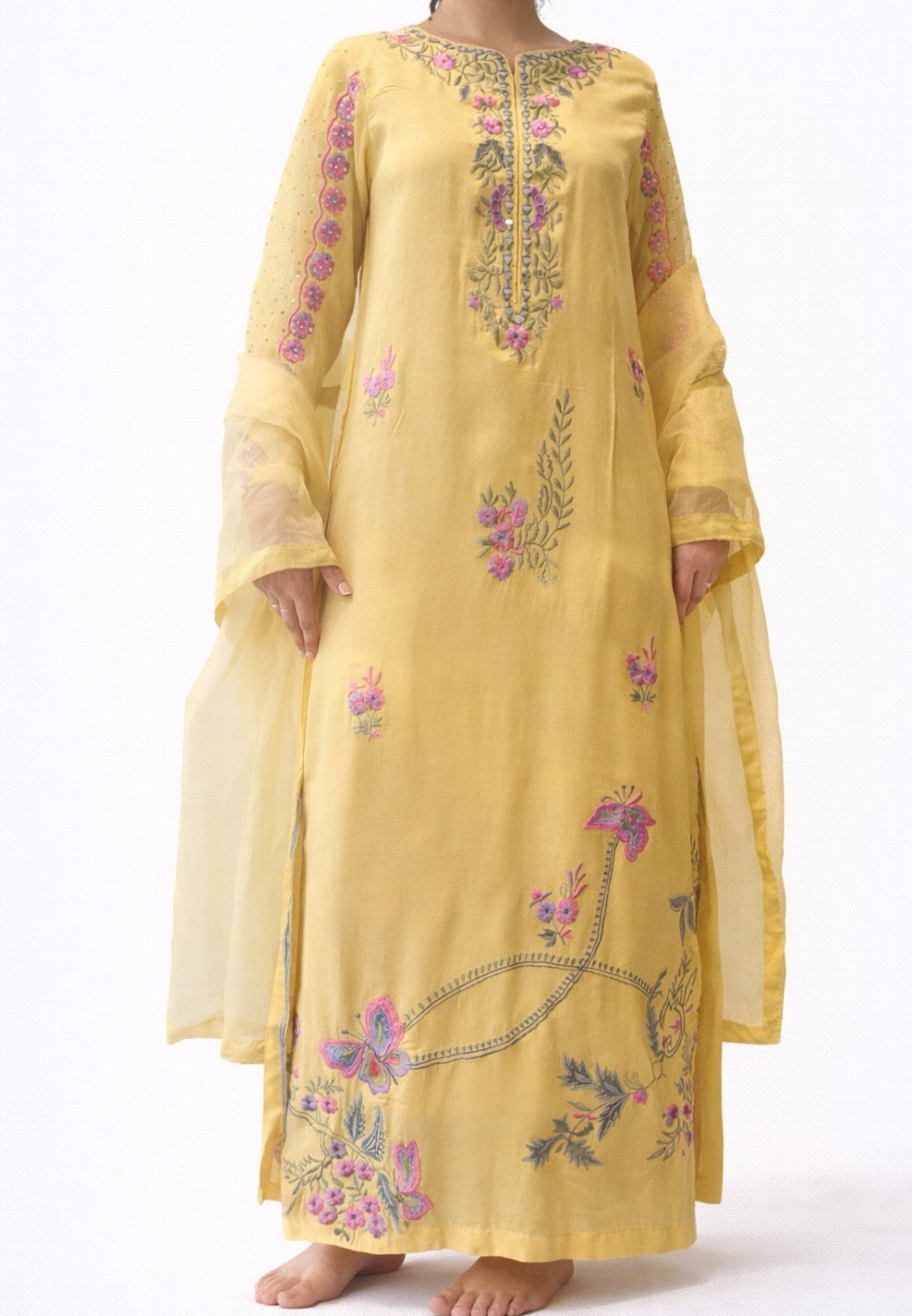 Yellow embroidered Punjabi Pakistani or Desi dress on a white background