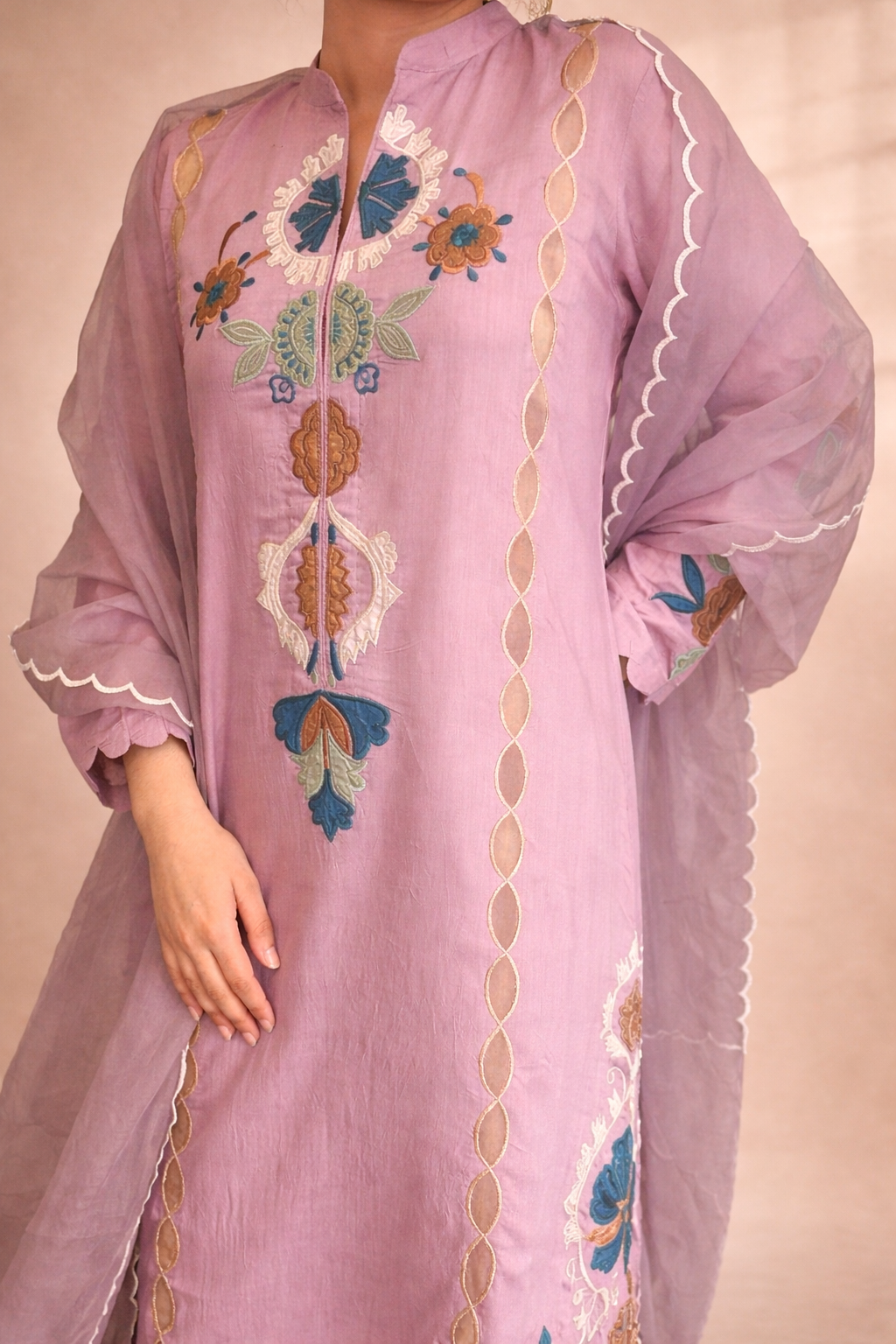 Neckline design of appliqué on Lavandar long ready to wear dress 